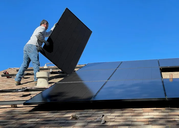 Solar panels installed on a residential rooftop under a clear sky